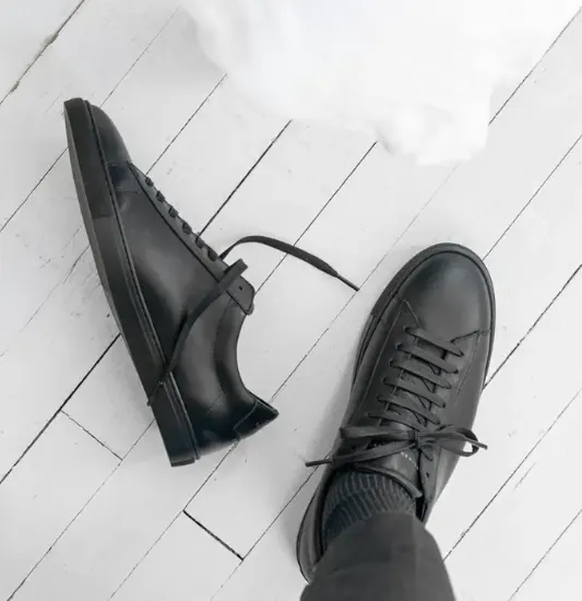 black sneaker in the air